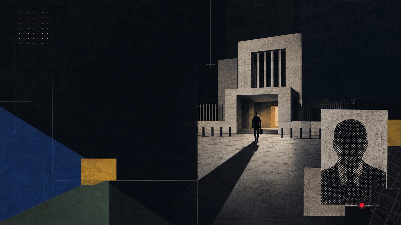 A lone diplomat approaching a brutalist embassy at night